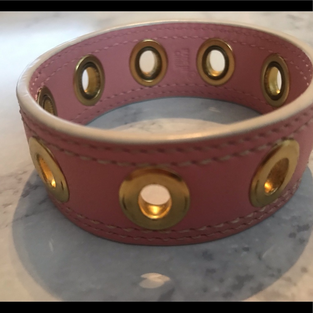 Coach blush pink leather cuff with gold grommets